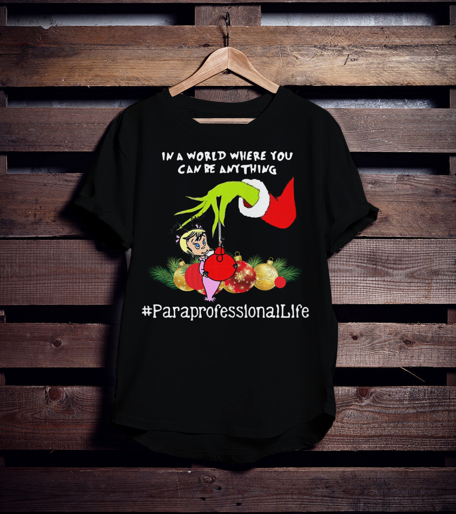 In A World Where You Can Be Anything Hand Grinch Holding Ornaments #ParaprofessionalLife T-Shirt