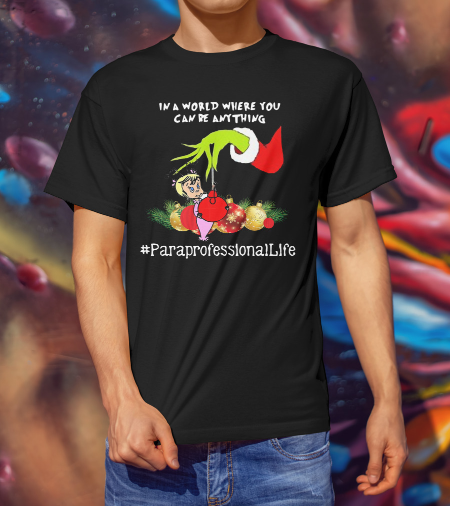 In A World Where You Can Be Anything Hand Grinch Holding Ornaments #ParaprofessionalLife T-Shirt