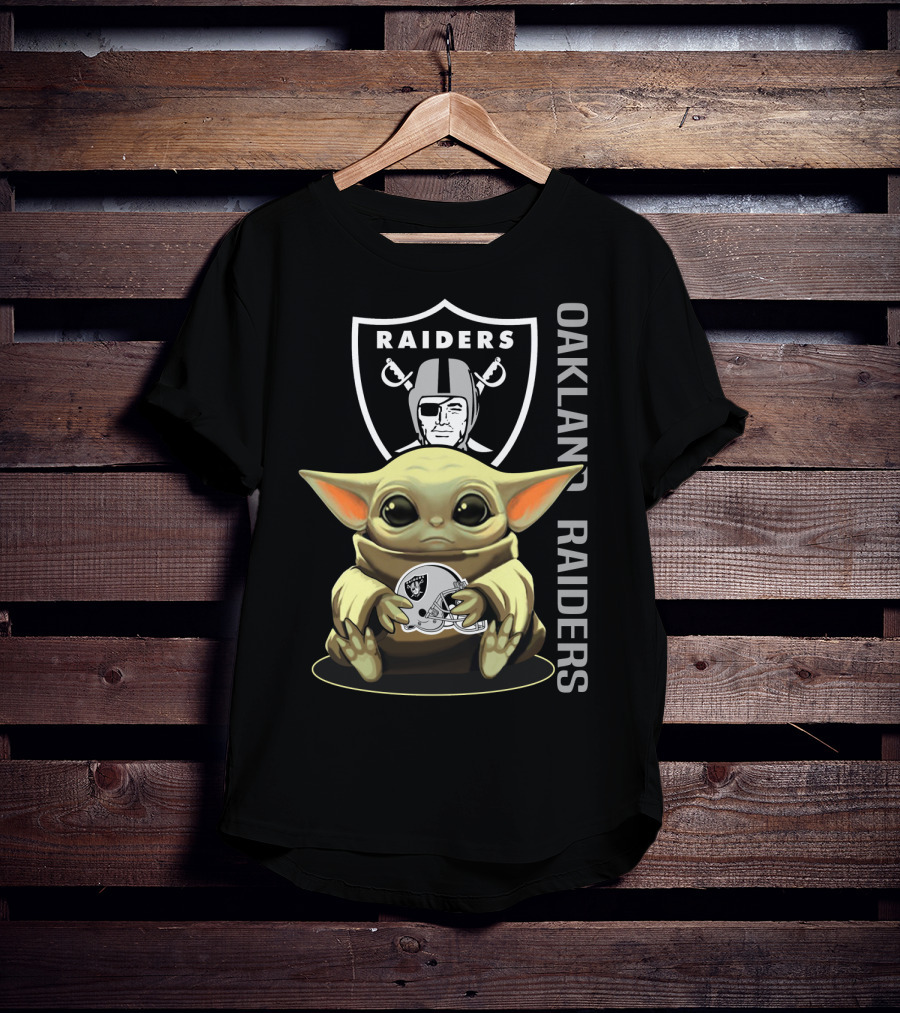 Baby Yoda Holding Oakland Raiders Helmet With Raiders Logo In Background T-Shirt