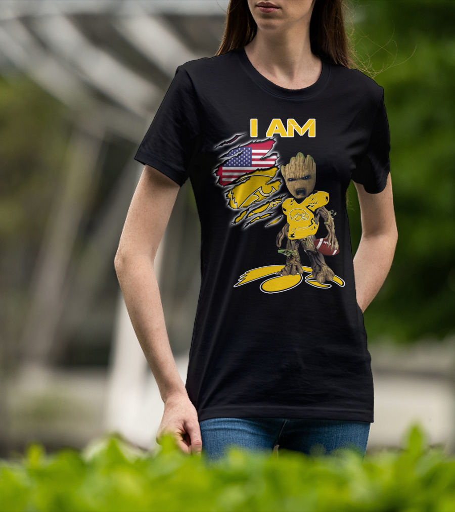 I Am Hawkeyes Baby Groot Holding Football With Usa Flag And Iowa Hawkeyes T-Shirt