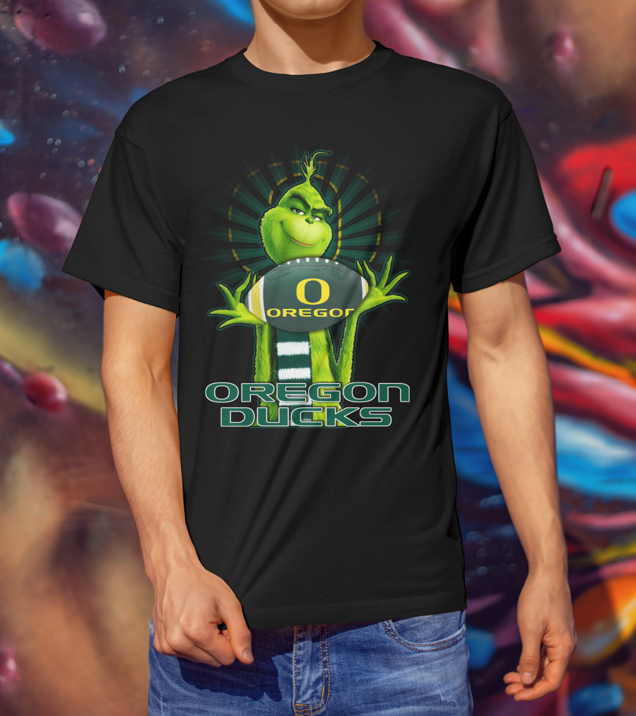 Grinch Holding Oregon Ducks Football T-Shirt