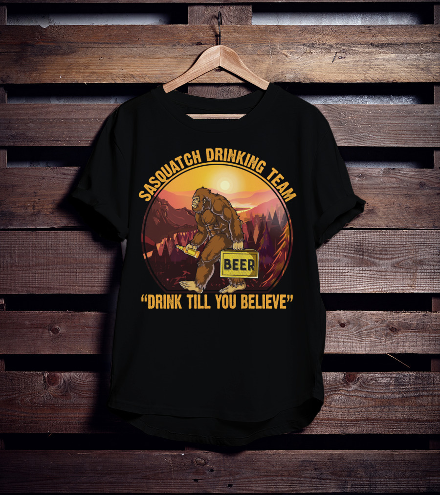 Sasquatch Drinking Team Beer Wilderness Sunset Funny Bigfoot Drink Till You Believe T-Shirt