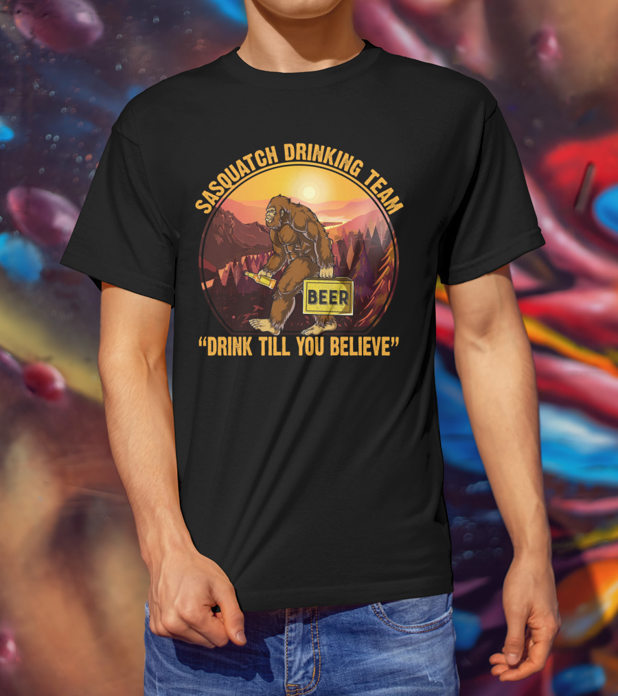 Sasquatch Drinking Team Beer Wilderness Sunset Funny Bigfoot Drink Till You Believe T-Shirt
