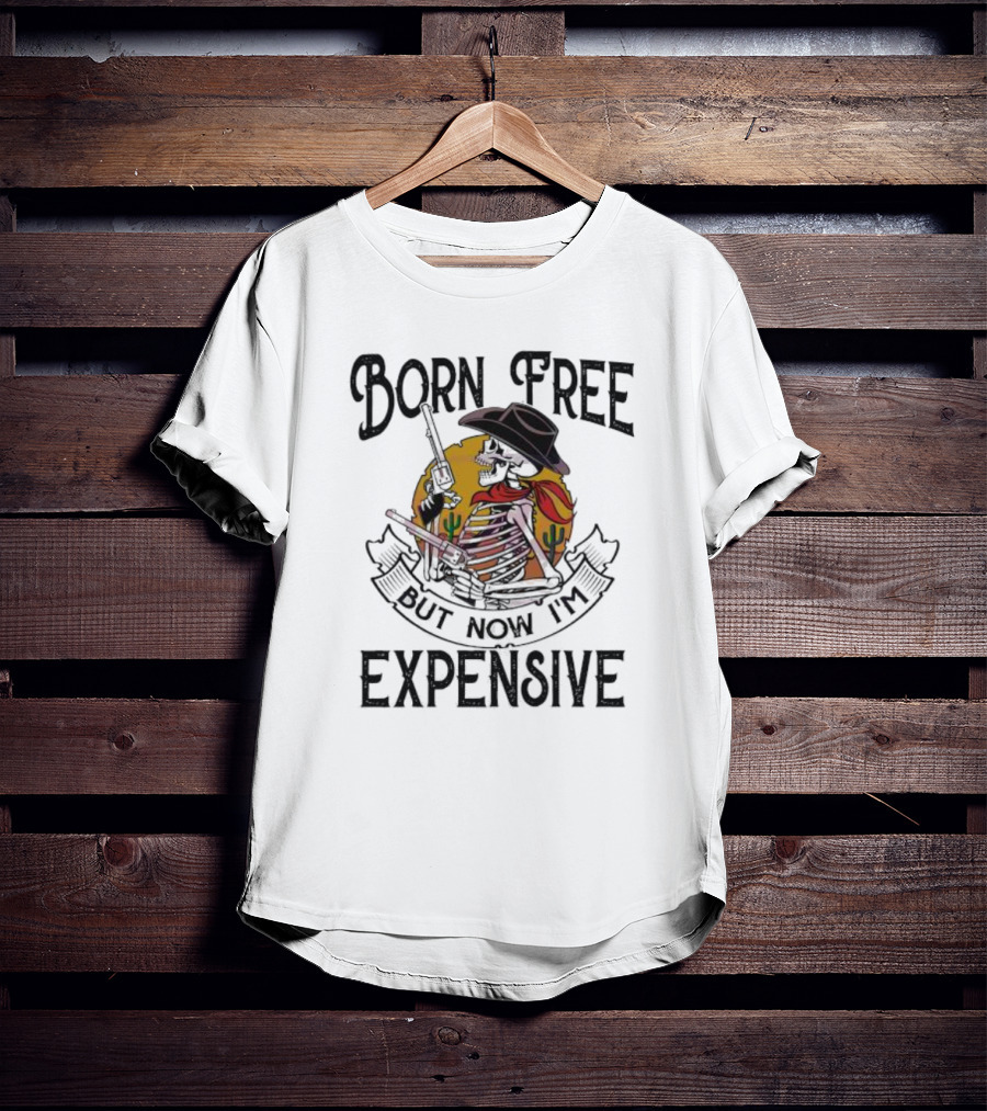 Skeleton Cowboy Born Free But Now I'm Expensive With Gun And Cactus Background T-Shirt