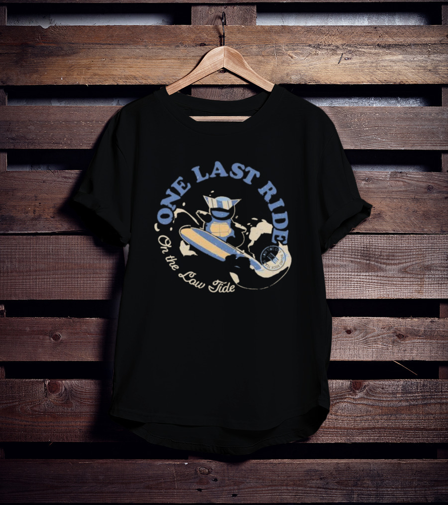 Surfing Adventure With Blue Masked Figure And Iconic Board 'One Last Ride On The Low Tide' T-Shirt
