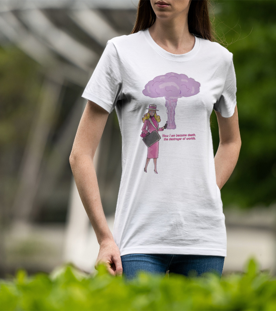 Now I Am Become Death The Destroyer Of Worlds Blonde Woman Pink Outfit Holding Bag Phone With Purple Mushroom Cloud T-Shirt