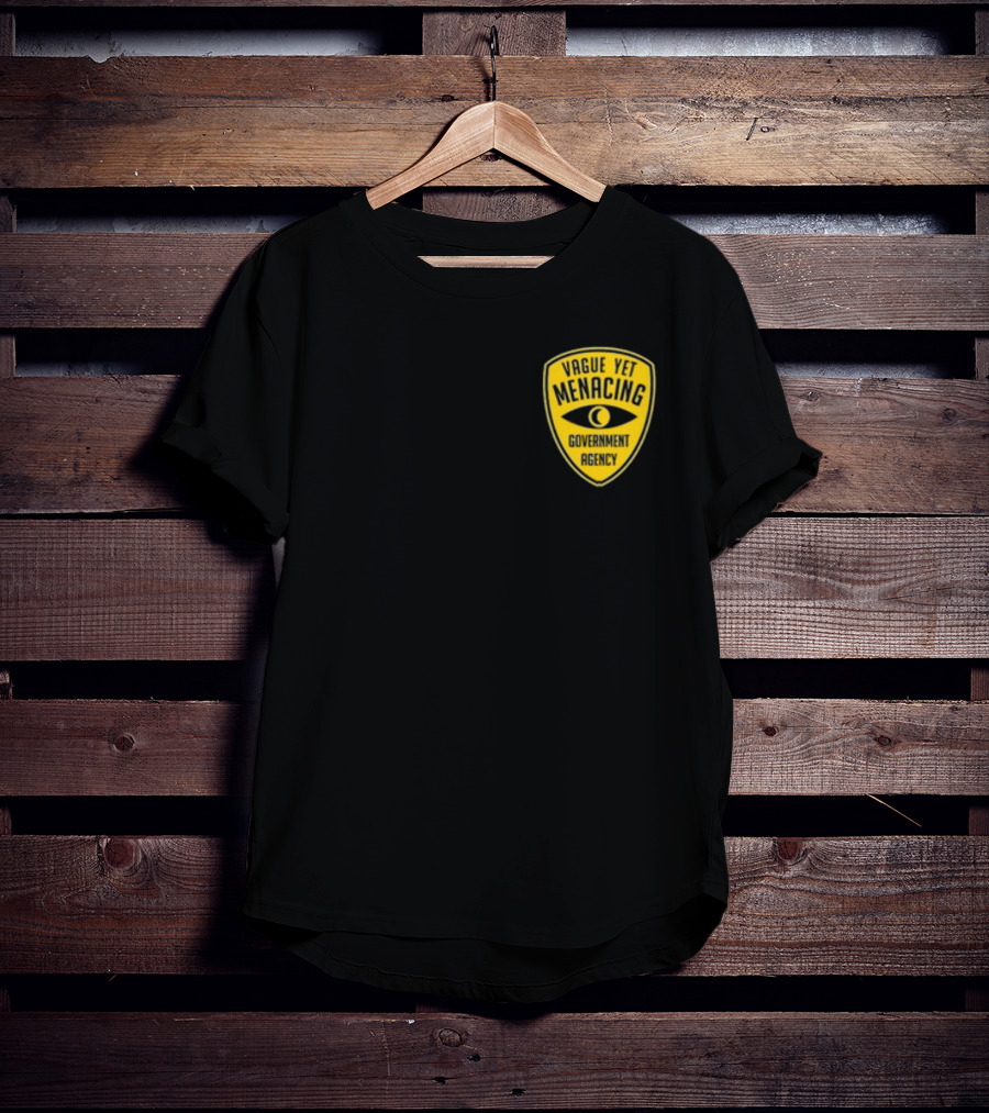 Vague Yet Menacing Government Agency Yellow Badge With Eye T-Shirt