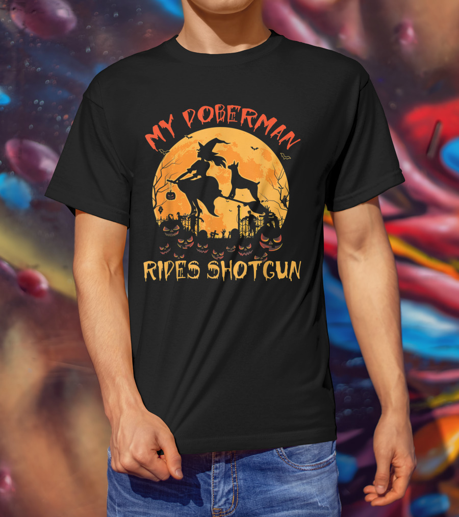 My Doberman Rides Shotgun Halloween Witch And Pumpkins Moon Scene T-Shirt