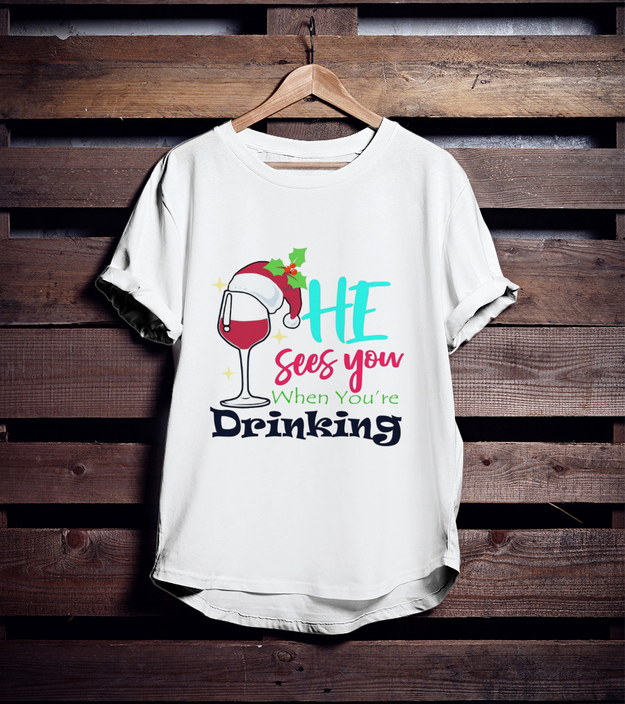 Santa Hat On Wine Glass With 'He Sees You When You're Drinking' Christmas Festive T-Shirt
