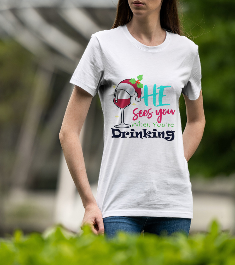 Santa Hat On Wine Glass With 'He Sees You When You're Drinking' Christmas Festive T-Shirt