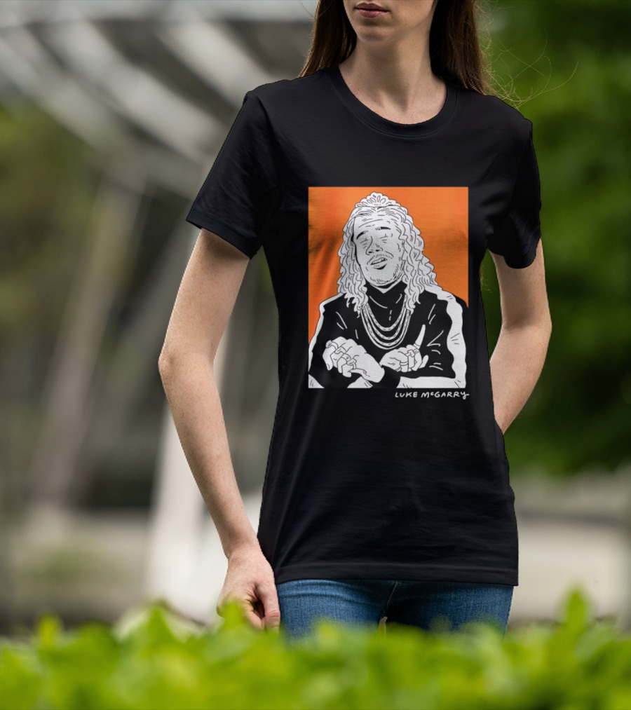 Luke McGarry Cartoon Character With Long Hair And Chains On Orange T-Shirt
