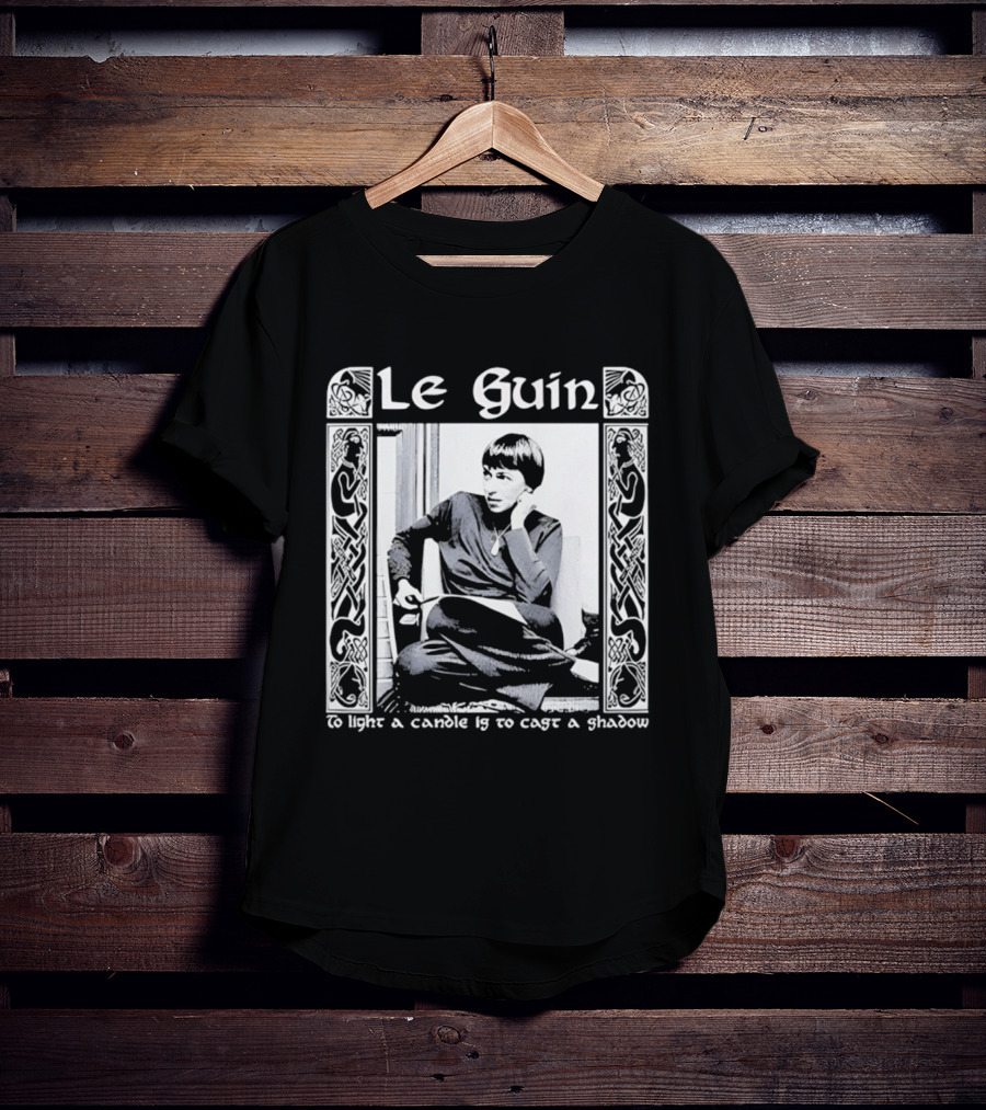 Le Guin To Light A Candle Is To Cast A Shadow T-Shirt