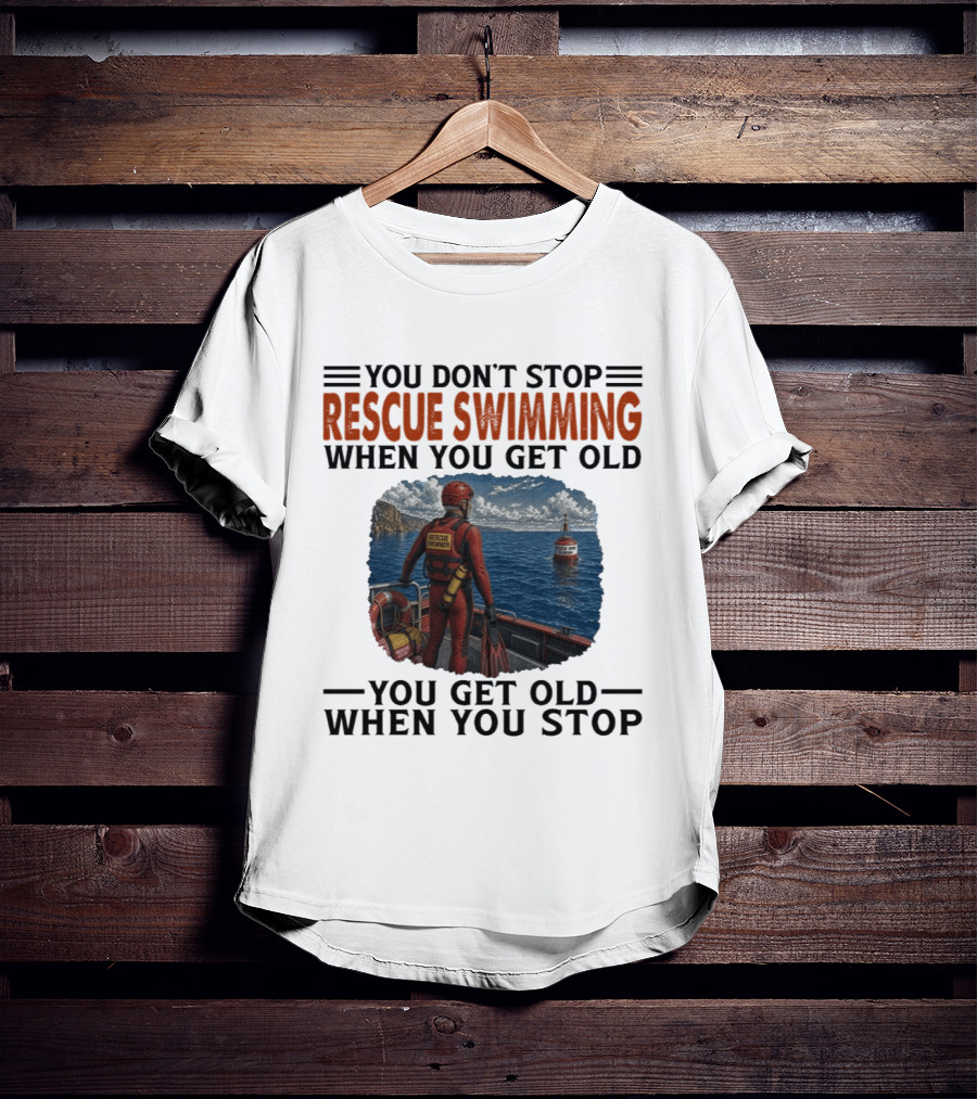 You Don't Stop Rescue Swimming When You Get Old You Get Old When You Stop Rescue Swimmer Standing On Boat Near Lighthouse T-Shirt