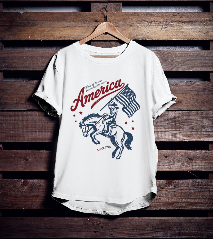 America Land Of The Free Home Of The Brave Since 1776 Cowboy Holding Flag Patriotic T-Shirt