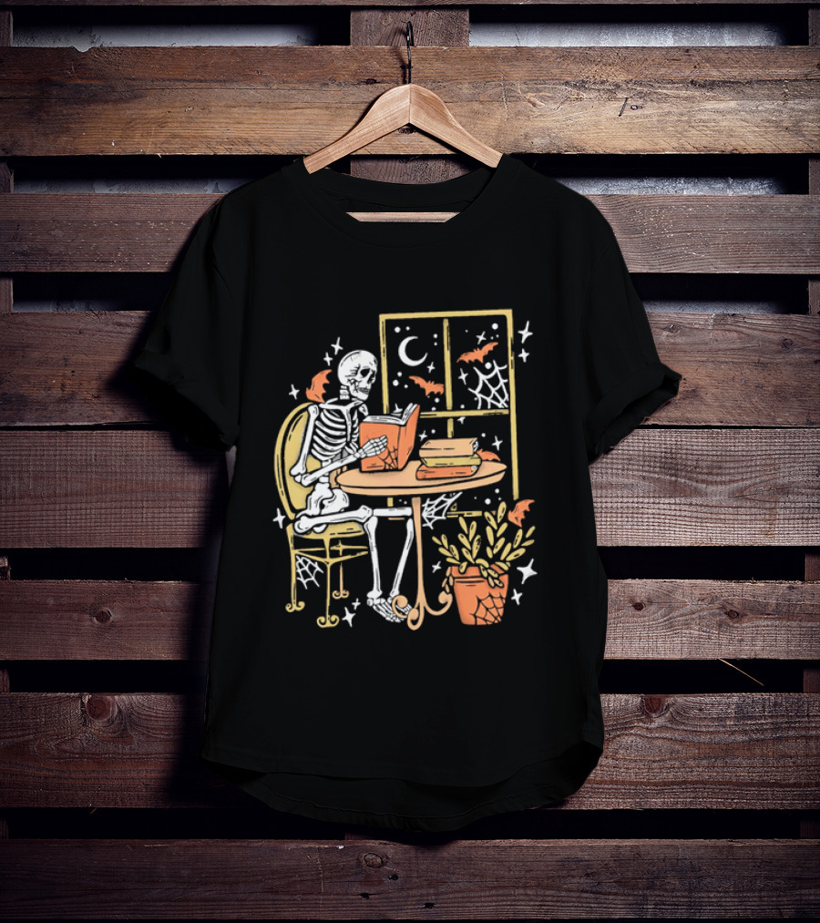 Cartoon Skeleton Reading Under Crescent Moon With Bats Orange Book Table Window T-Shirt