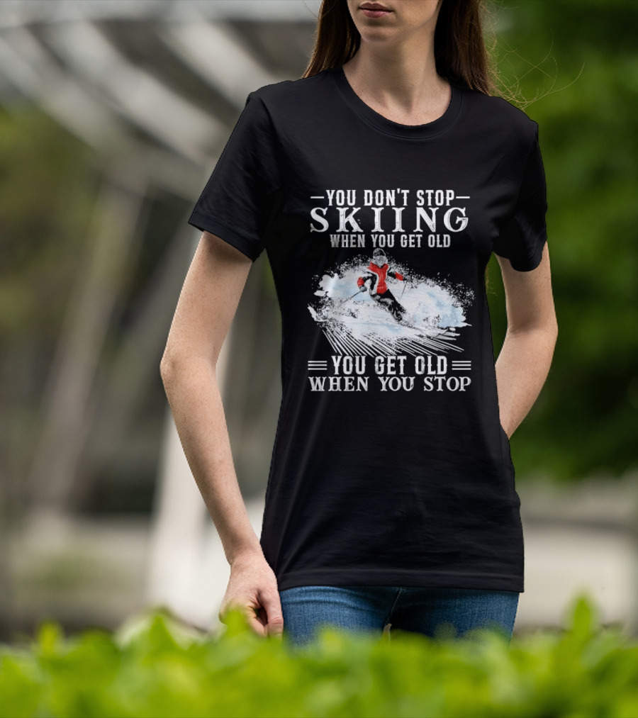 You Don't Stop Skiing When You Get Old You Get Old When You Stop Older Woman Skier Spraying Snow T-Shirt