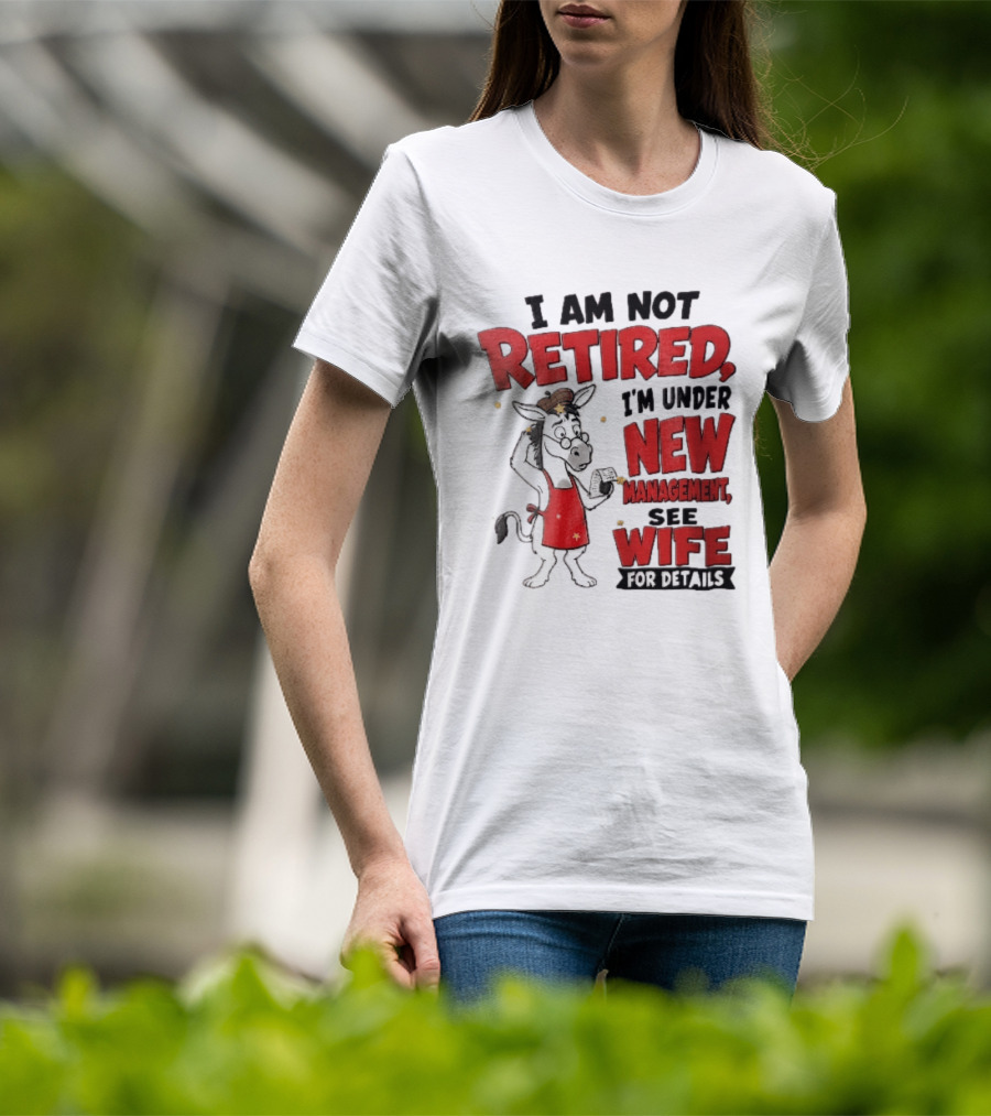 I Am Not Retired I'm Under New Management See Wife For Details Cartoon Donkey Red Apron T-Shirt