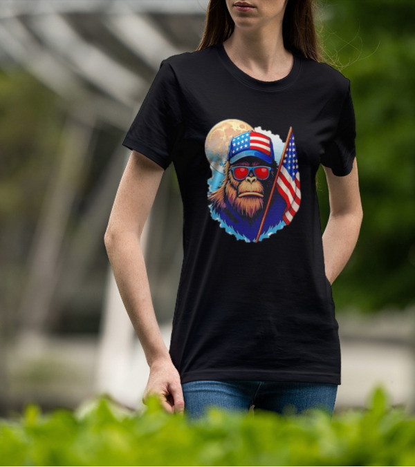 Bigfoot USA Flag Hat Sunglasses Patriotic Moon Background T-Shirt