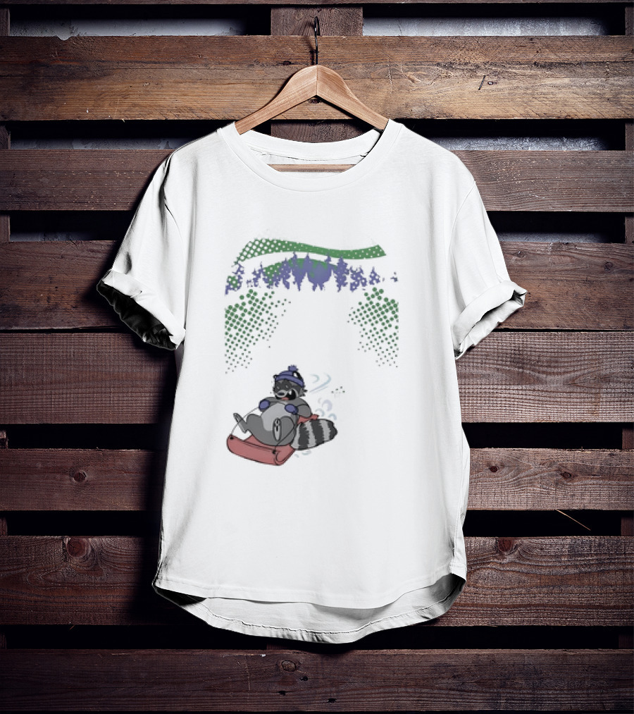 Raccoon Sledding In Winter Forest Scene With Evergreen Trees And Snowflakes T-Shirt
