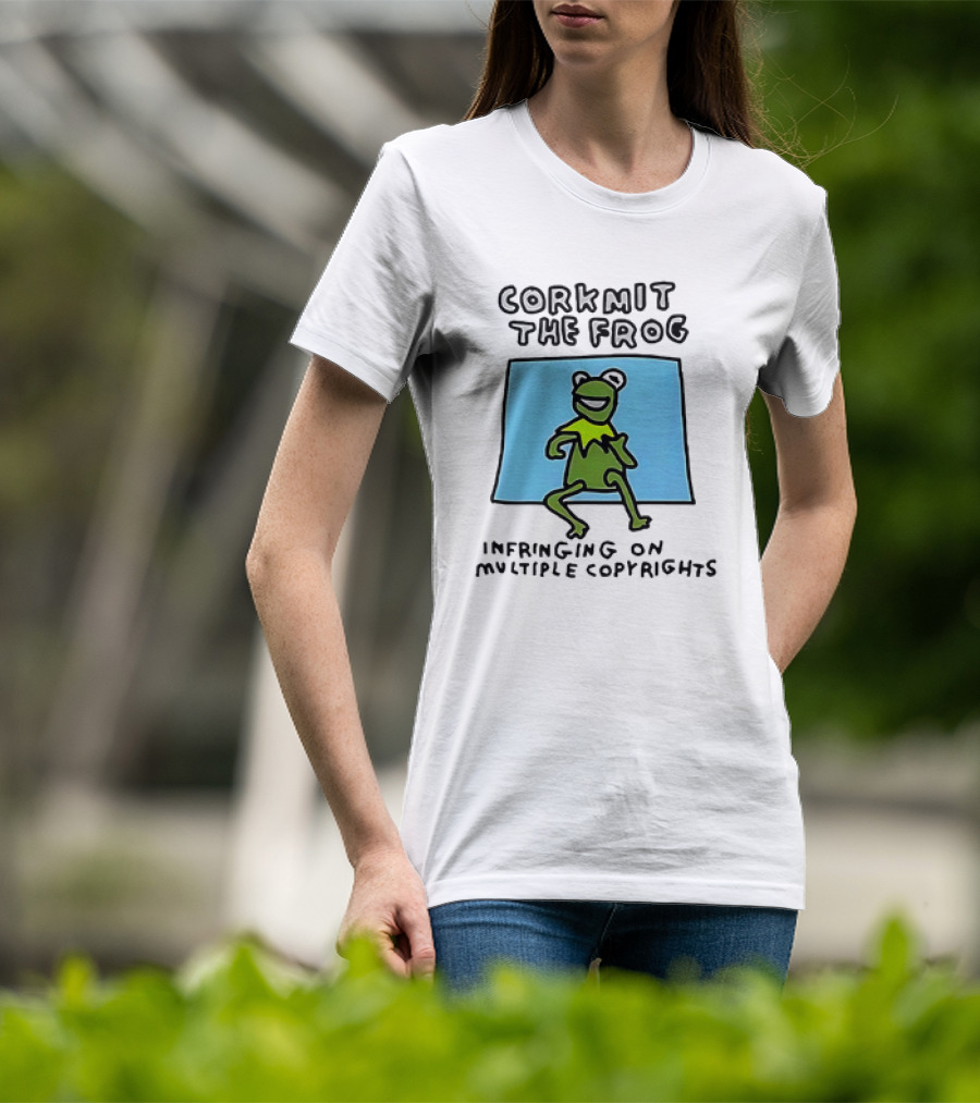 Corkmit The Frog Infringing On Multiple Copyrights Green Frog Cartoon With Blue Background T-Shirt