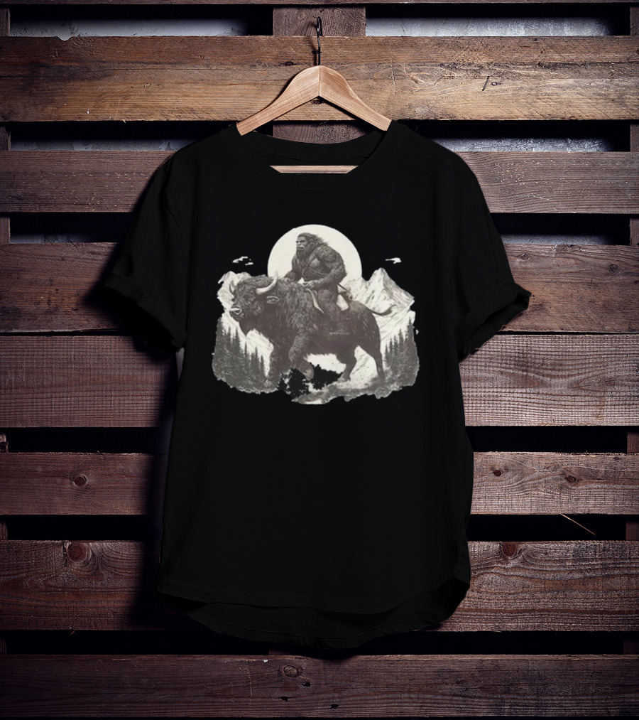 Blurry Creatures Bigfoot Riding Buffalo With Mountains And Moon In Background T-Shirt