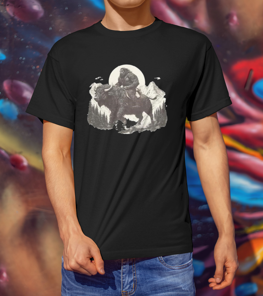 Blurry Creatures Bigfoot Riding Buffalo With Mountains And Moon In Background T-Shirt