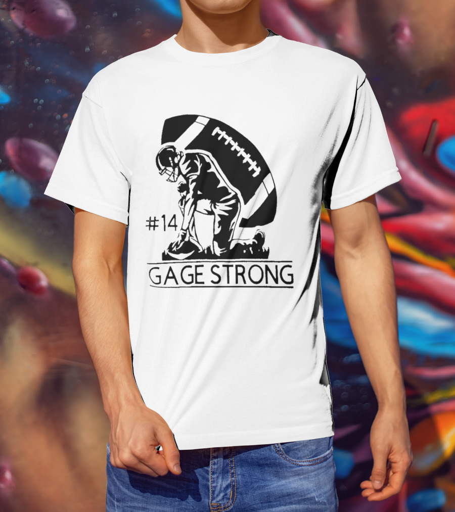 Gage Strong #14 Football Player Kneeling In Front Of Large Football T-Shirt
