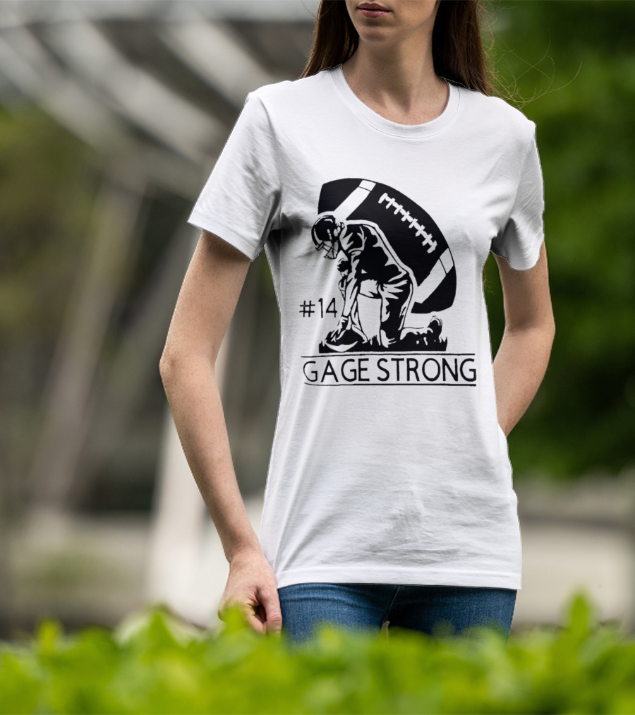 Gage Strong #14 Football Player Kneeling In Front Of Large Football T-Shirt