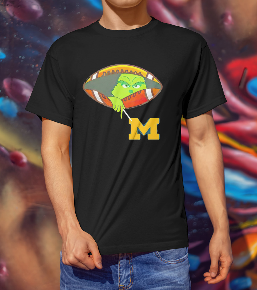 Grinch Peeking From Football Over Michigan Wolverines T-Shirt