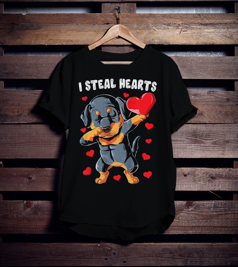Dabbing Rottweiler Holding Heart Surrounded By I Steal Hearts Text T-Shirt