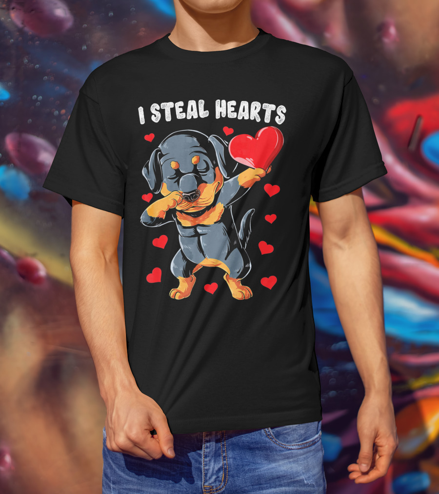 Dabbing Rottweiler Holding Heart Surrounded By I Steal Hearts Text T-Shirt