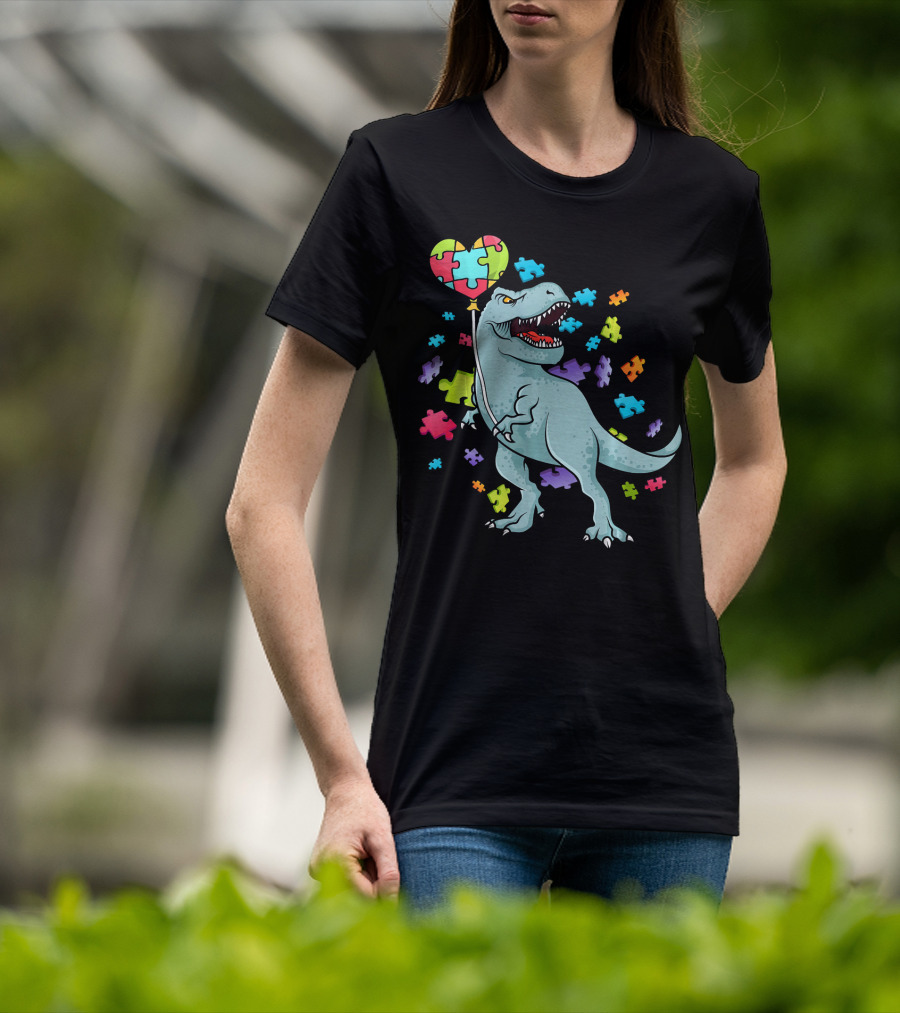 Autism Awareness Dinosaur With Puzzle Heart Balloon And Colorful Puzzle Pieces T-Shirt
