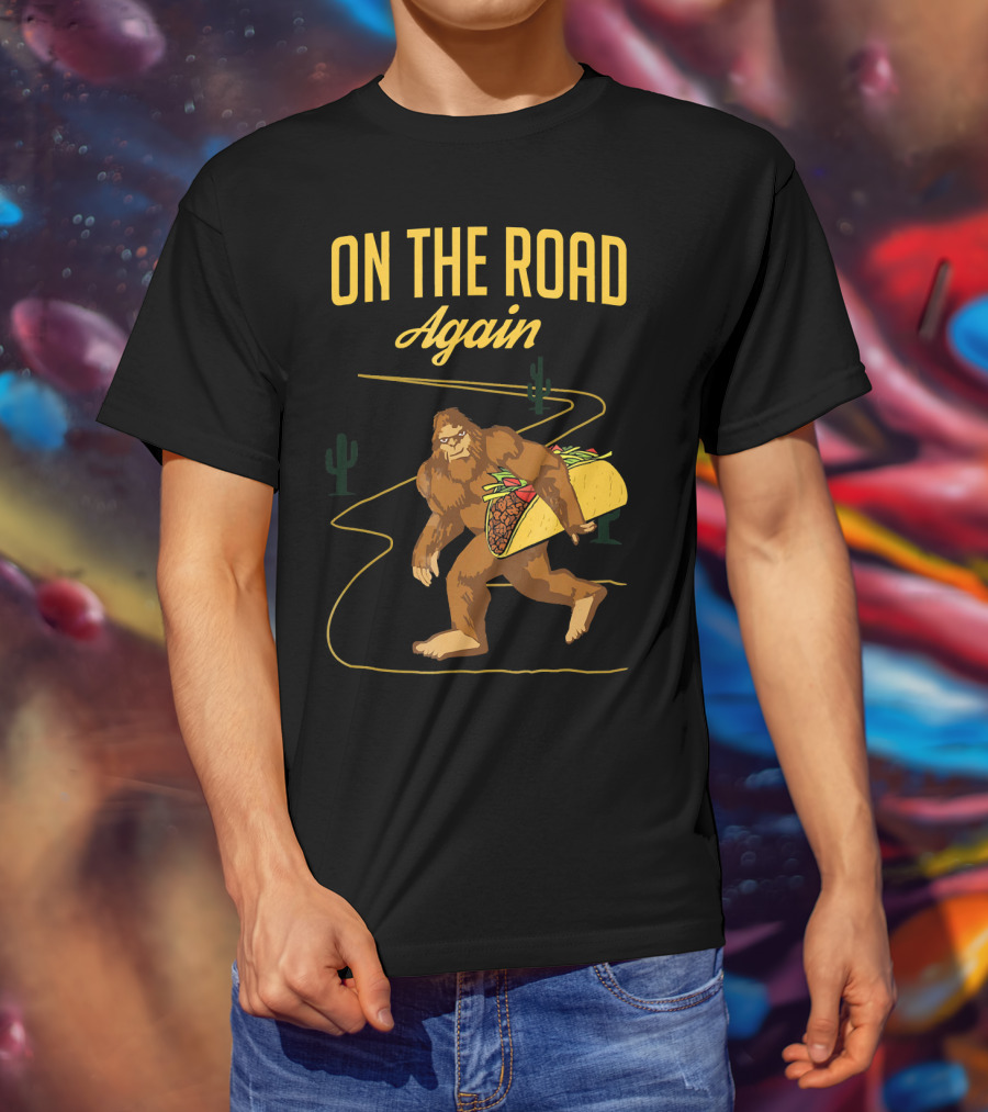 ON THE ROAD AGAIN Smirk Bigfoot Sasquatch Carrying Taco T-Shirt