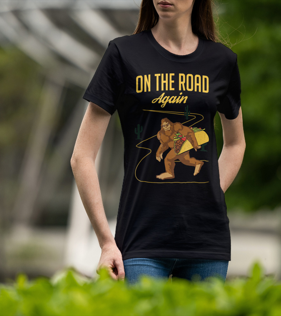 ON THE ROAD AGAIN Smirk Bigfoot Sasquatch Carrying Taco T-Shirt