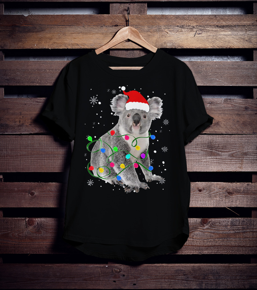 Koala Wrapped In Christmas Lights Wearing Santa Hat With Snowflakes Matching Fam T-Shirt