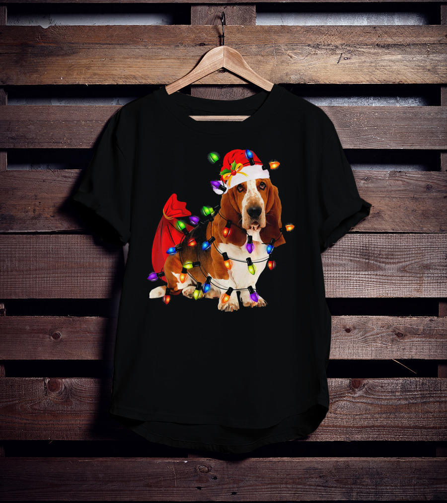 Basset Hound Wrapped In Christmas Lights With Santa Hat And Red Sack T-Shirt