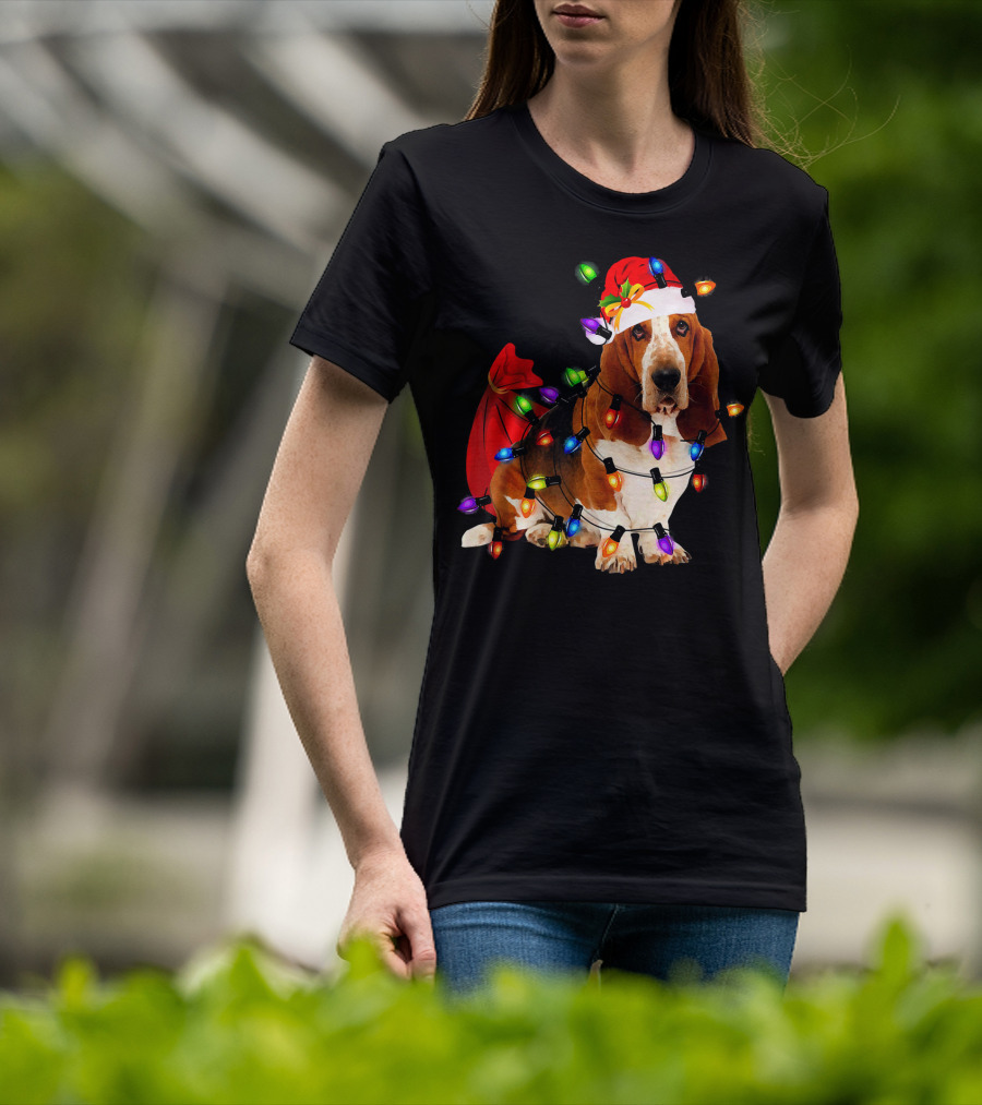Basset Hound Wrapped In Christmas Lights With Santa Hat And Red Sack T-Shirt