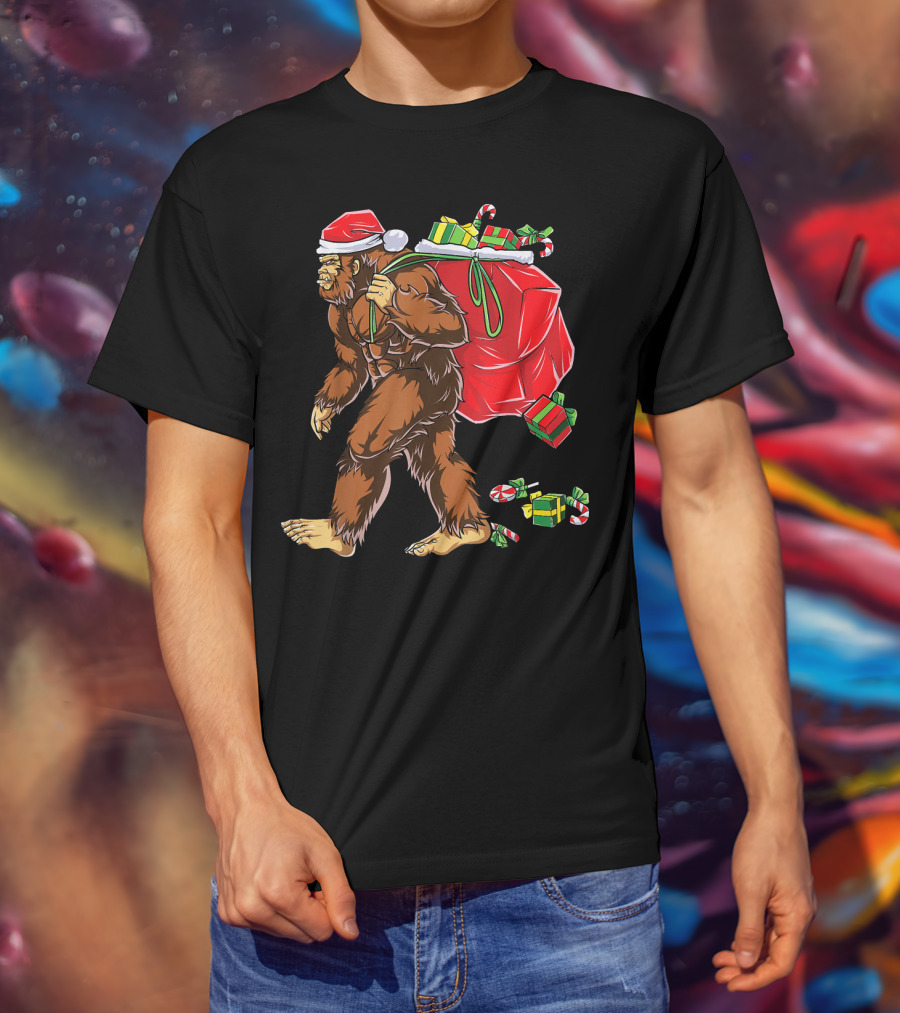 Bigfoot Santa Hat Carrying Christmas Presents And Candy Canes T-Shirt