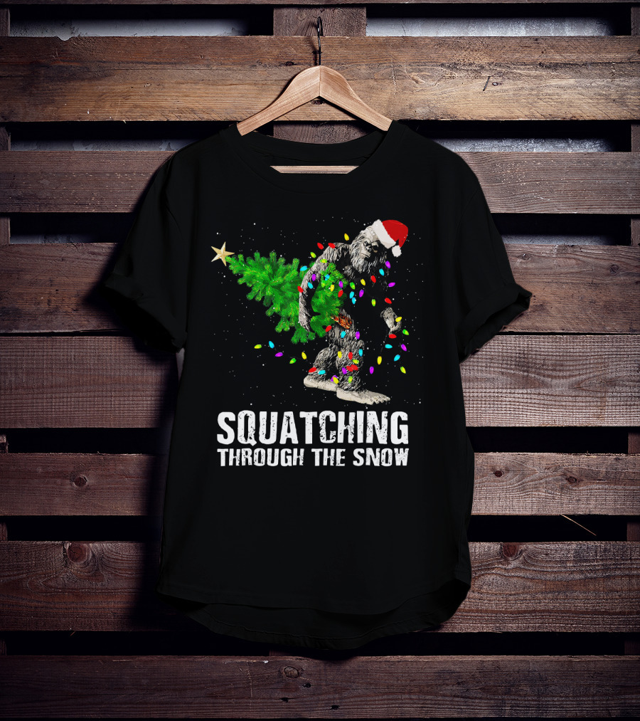 Squatching Through The Snow Bigfoot Christmas Lights Santa Hat T-Shirt