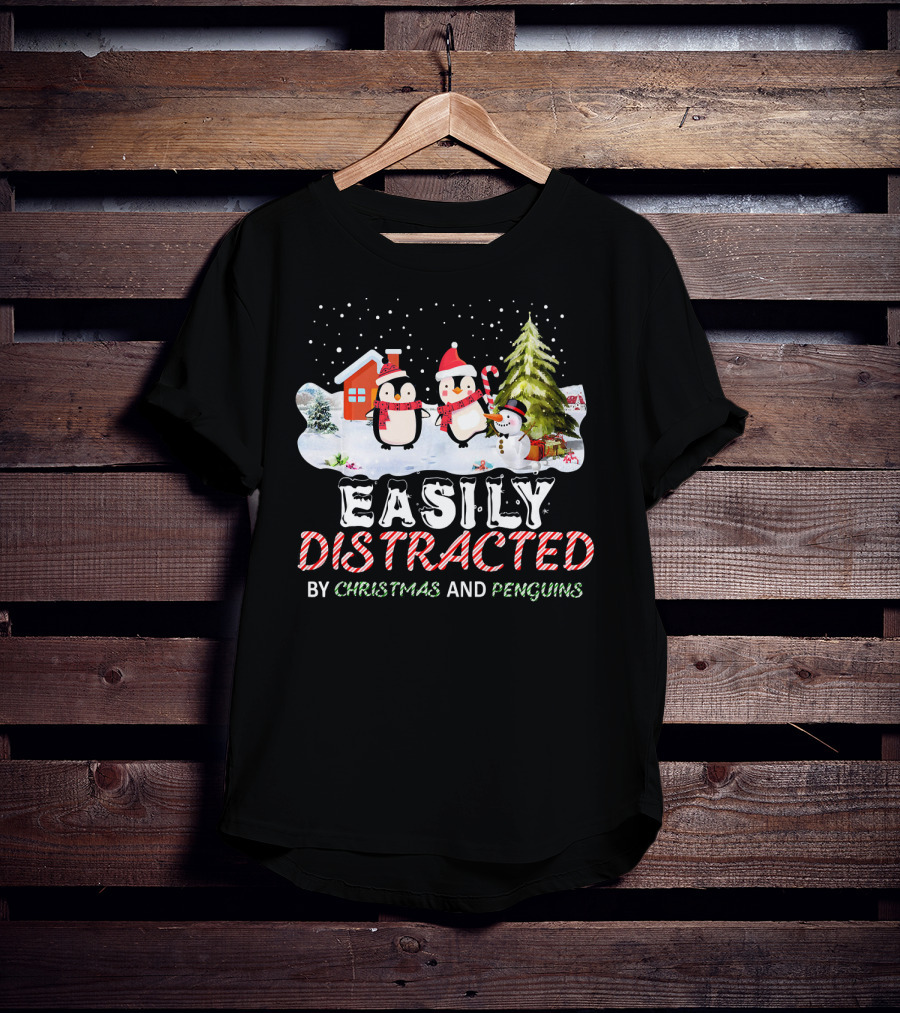 Easily Distracted By Christmas And Penguins In Winter Wonderland With Snowman House And Tree T-Shirt