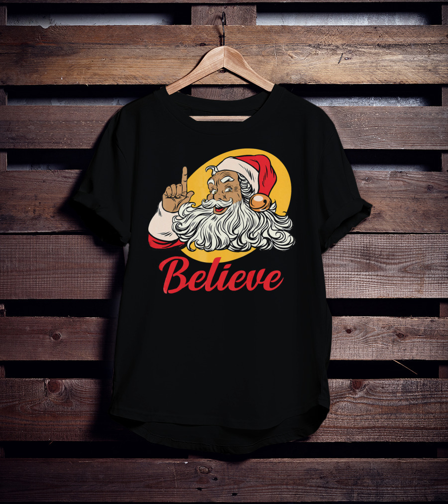 Black Santa Claus With Believe Caption And Yellow Background T-Shirt