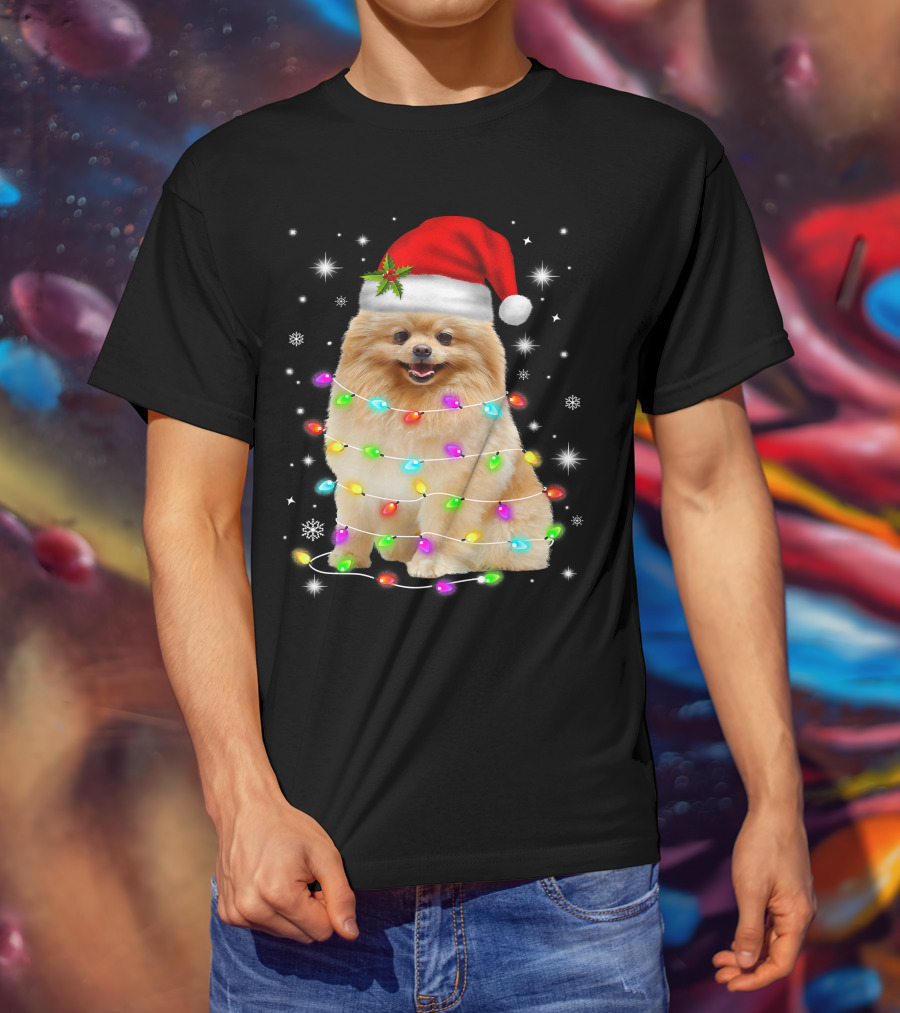 Pomeranian Pup Wrapped In Christmas Lights With Santa Hat And Festive Glow T-Shirt