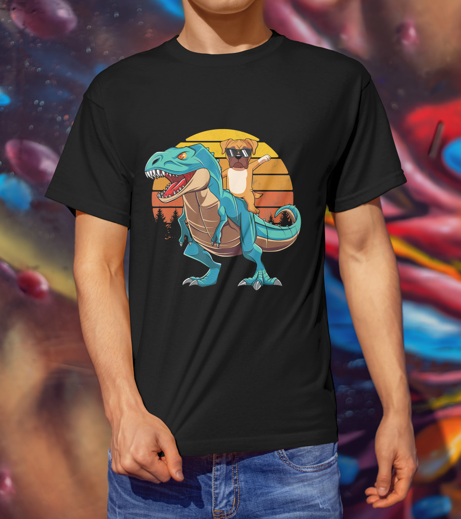 Boxer Dog With Sunglasses Riding Blue T-Rex Against Sunset Background T-Shirt